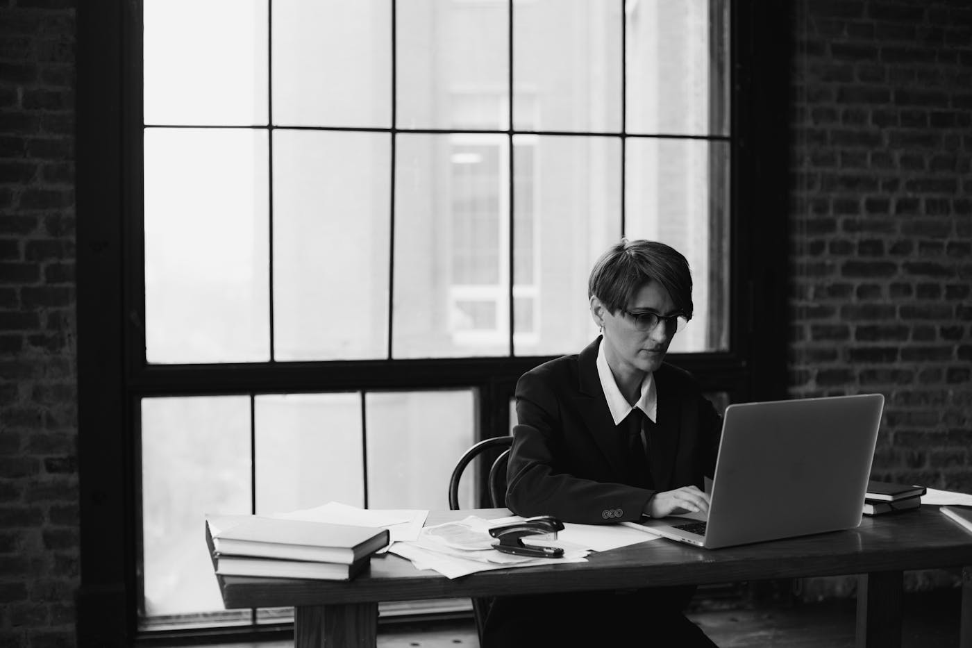 One person reviewing work on a laptop